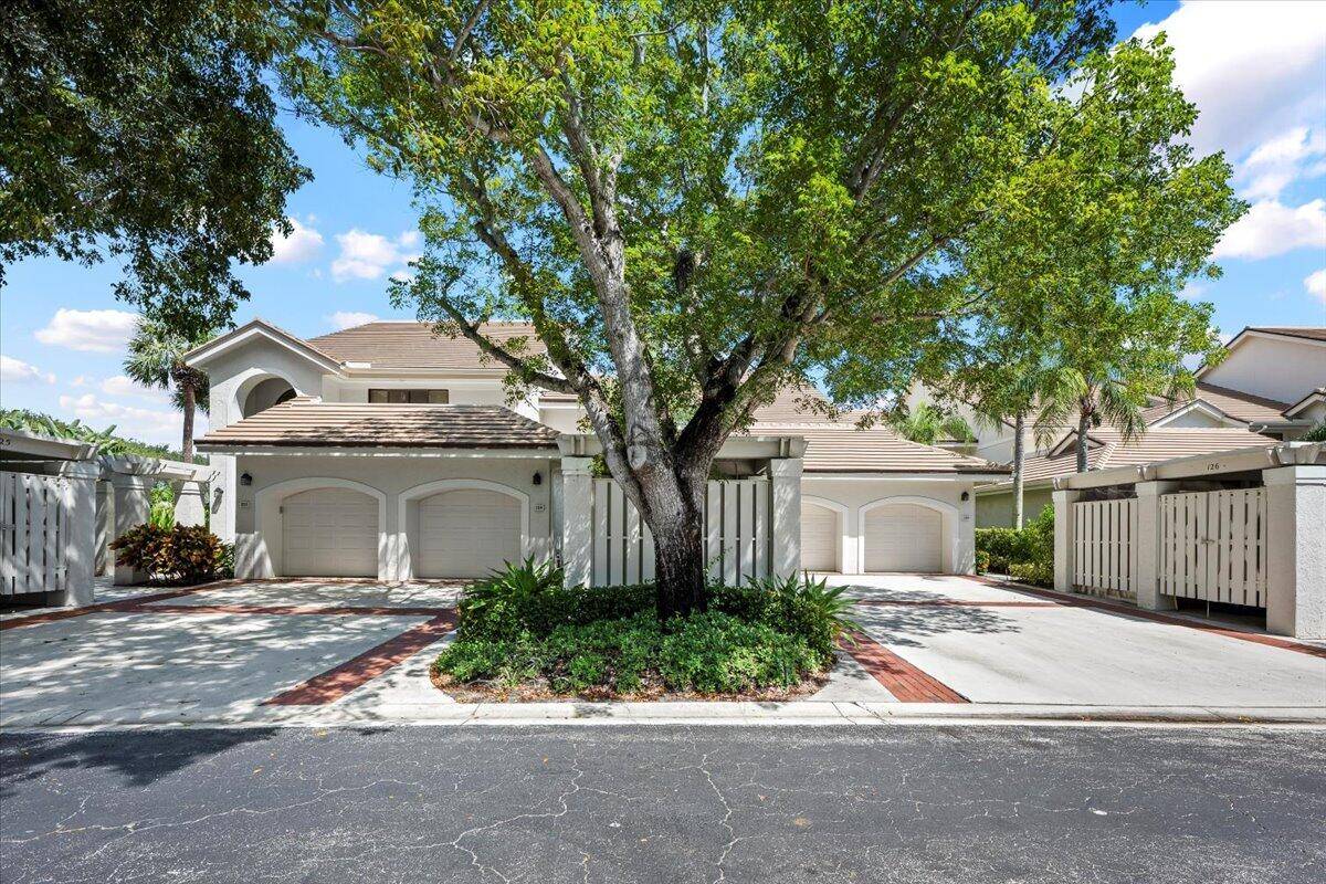 Experience tranquil waterfront living with elevated views in the sought after West Bay Community of Jonathan's Landing in the heart of Jupiter.