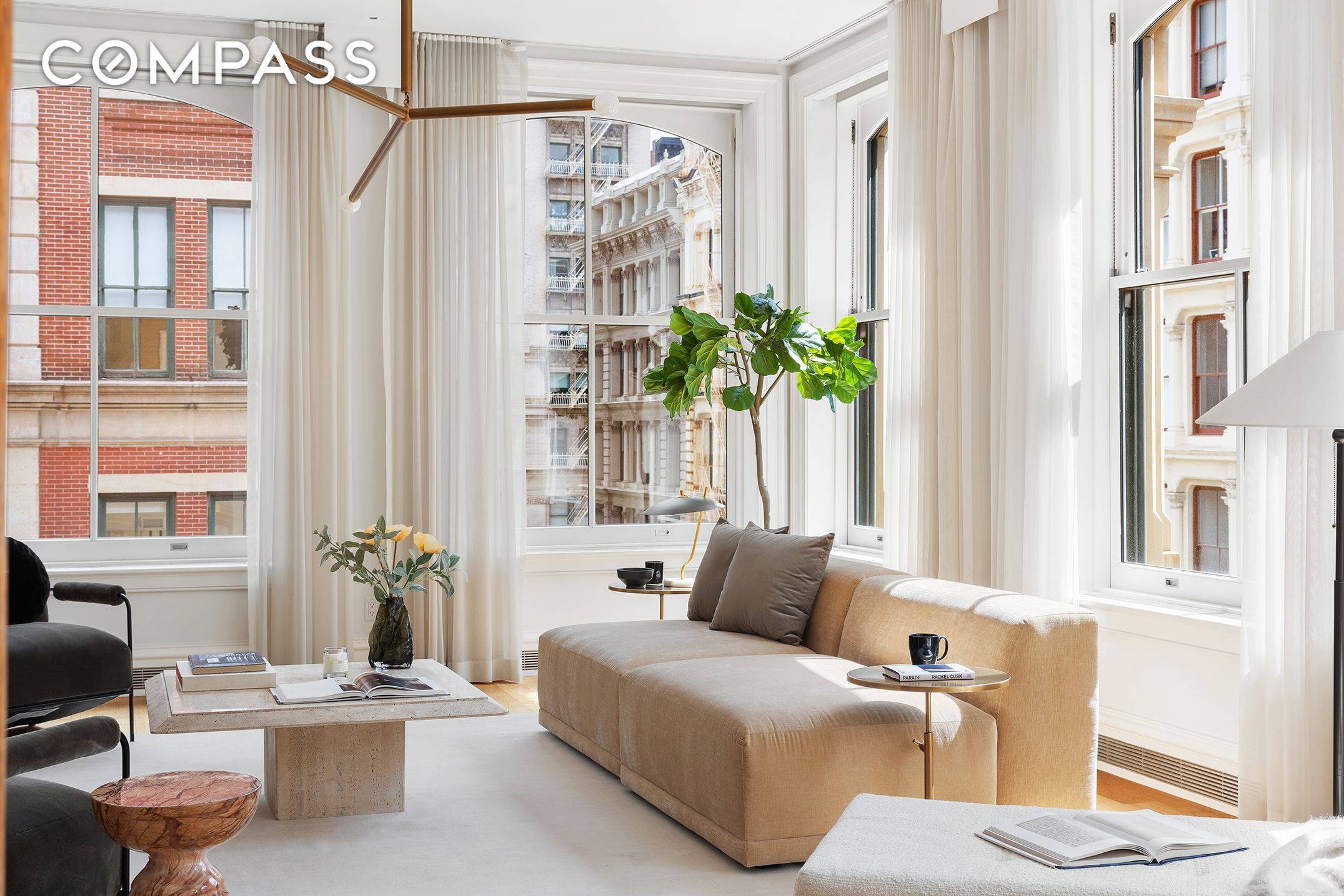 This expansive Soho Corner Loft Condo, located in an Iconic Cast iron Landmark, celebrates Light with 11 dramatic South and East facing windows overlooking historic Greene and Broome Streets.