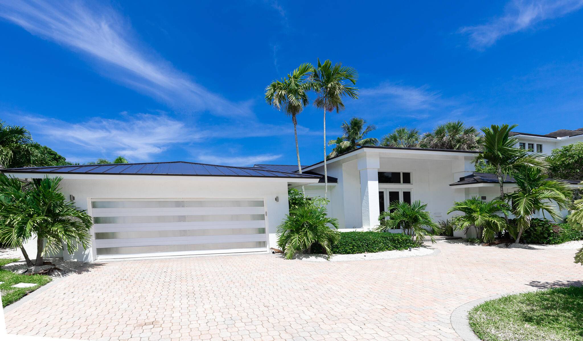 Welcome to the epitome of luxurious living at 2388 Queen Palm Road, nestled in the highly prestigious Royal Palm Yacht and Country Club of Boca Raton.