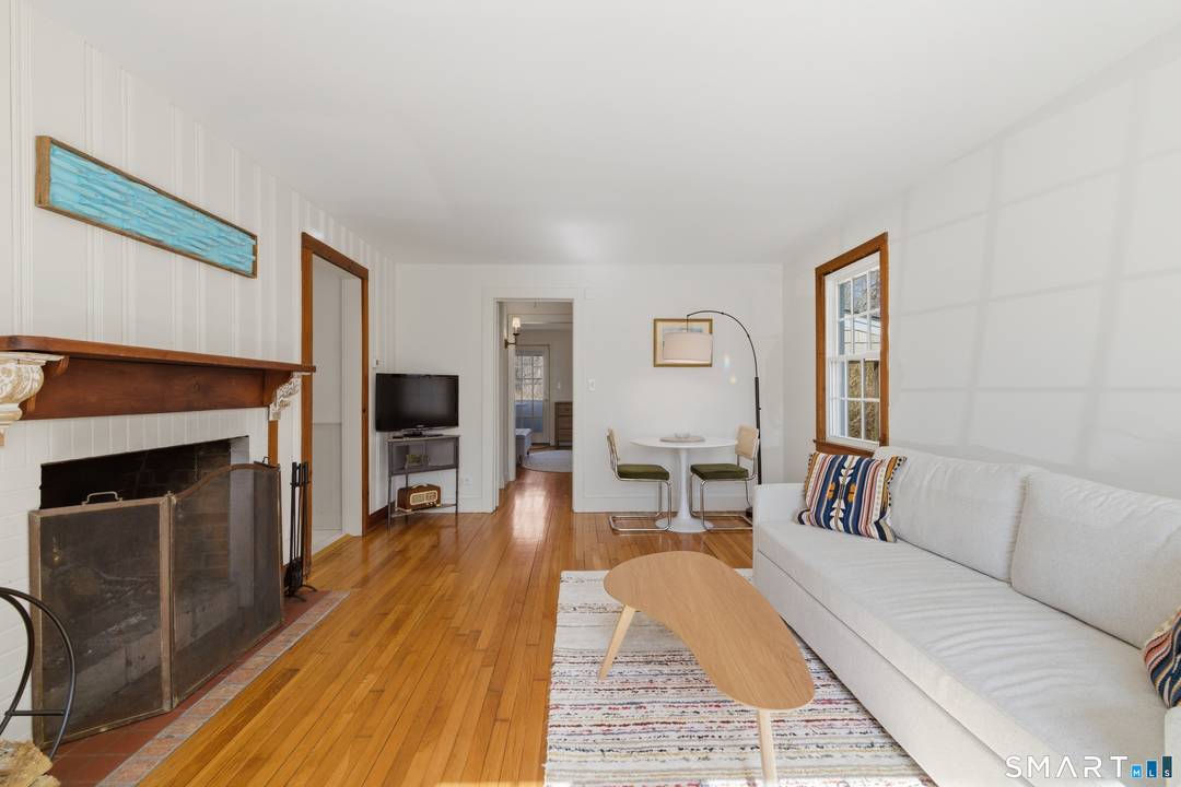 Discover the charm of coastal living with this turn key New England summer cottage, ideally situated between Stonington and Mystic just one mile outside the borough.