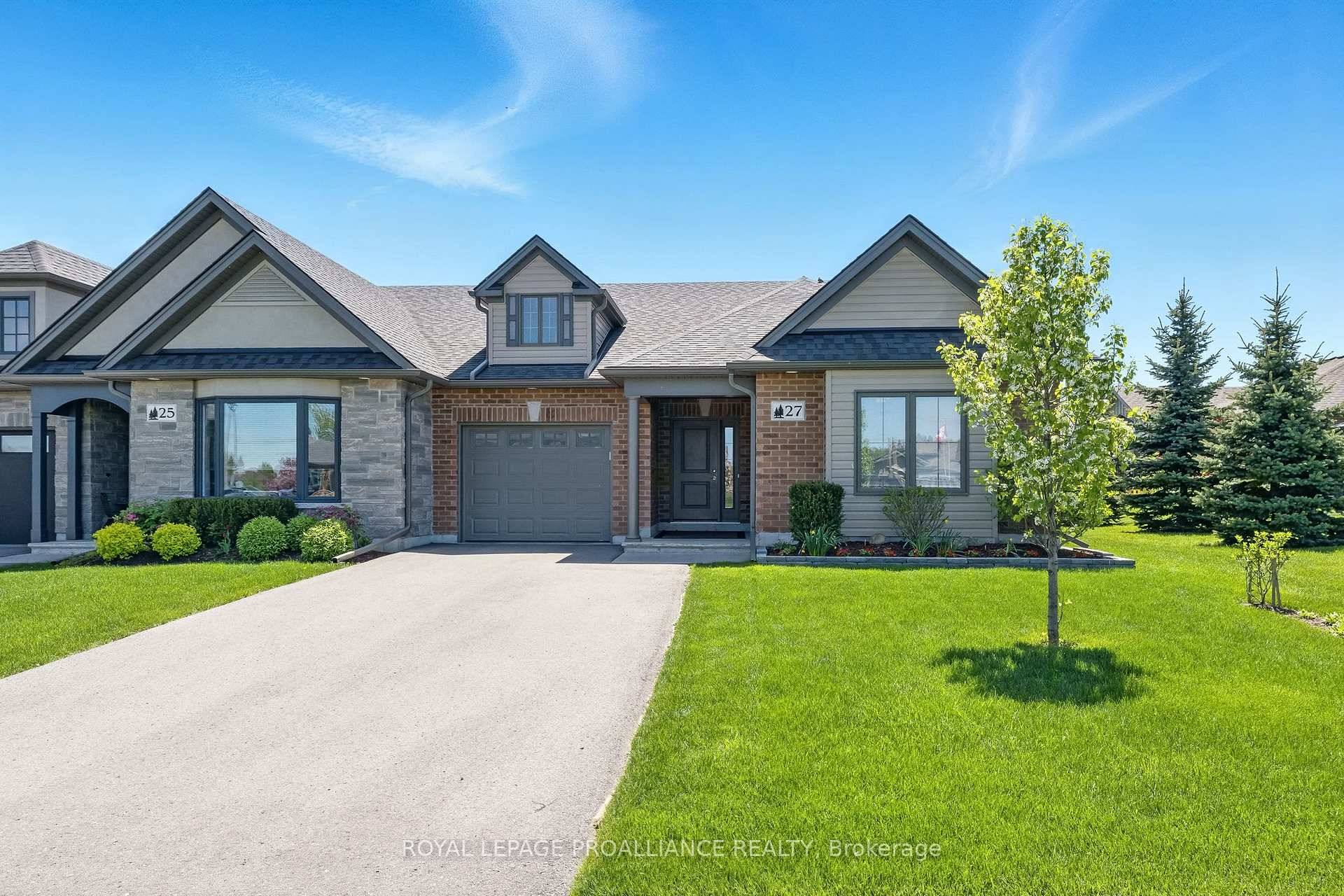 Live steps from the shores of Lake Ontario in this immaculate, all brick, luxury FREEHOLD end unit townhome !
