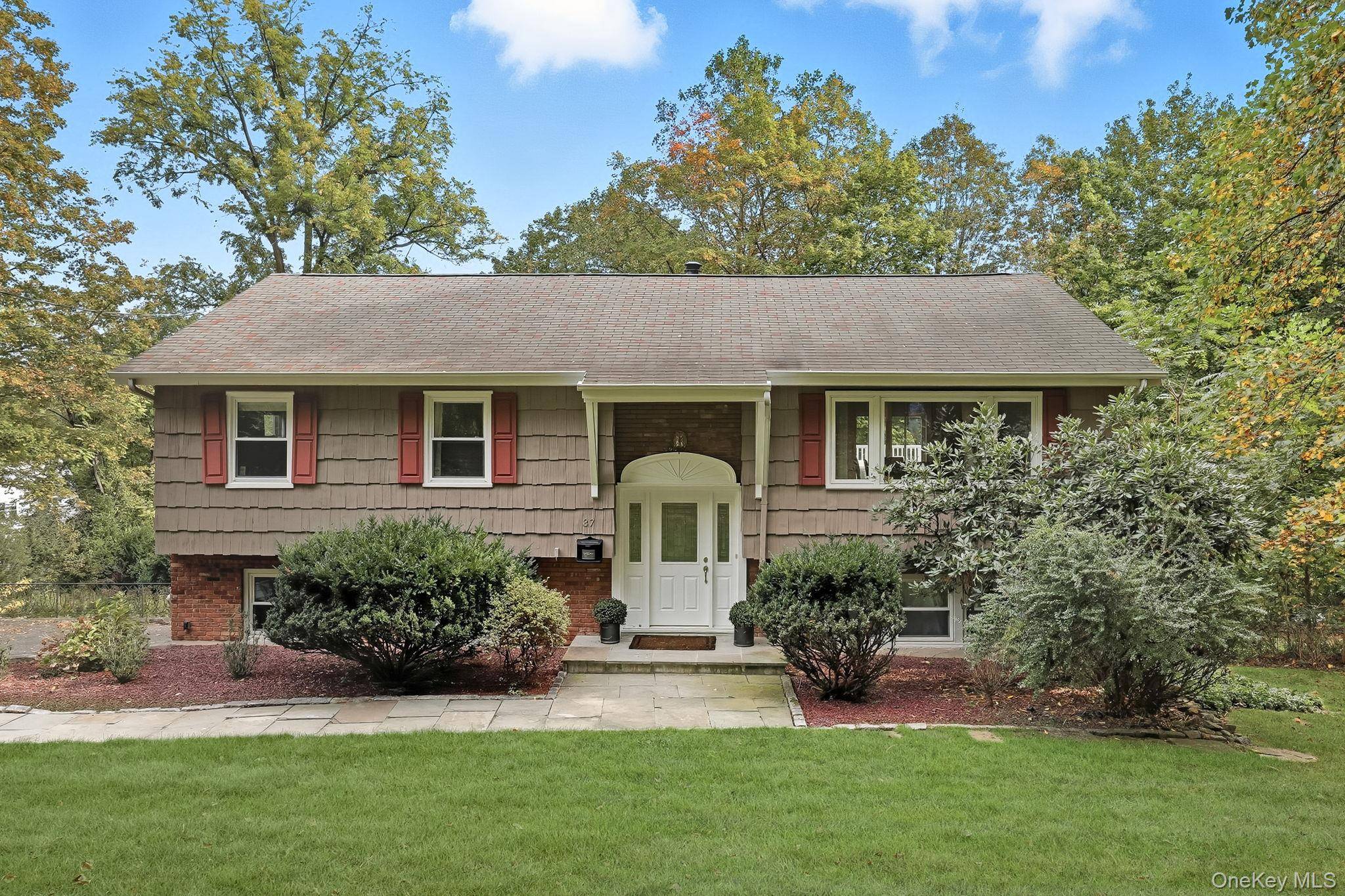 Beautifully renovated 4 bedroom, 3 bath home on a lush, private half acre located at the end of a cul de sac and just moments from Briarcliff Manor's village center.