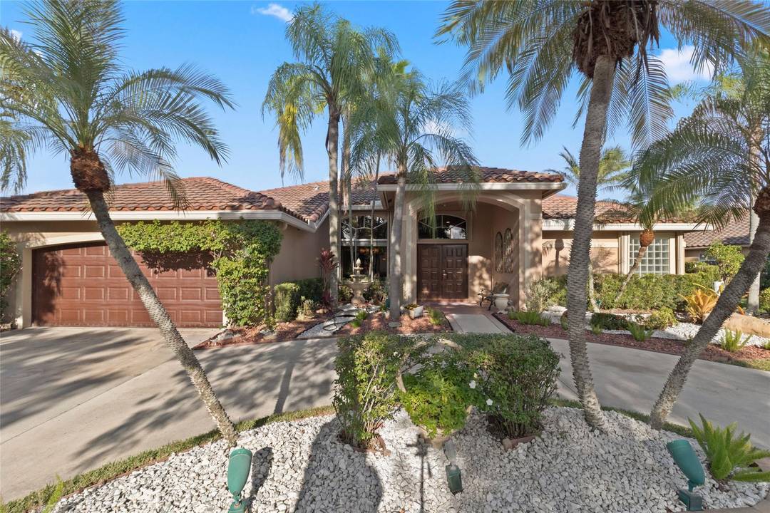 Fabulous pool home in the sought after guarded gated community of The Lakes in Weston.