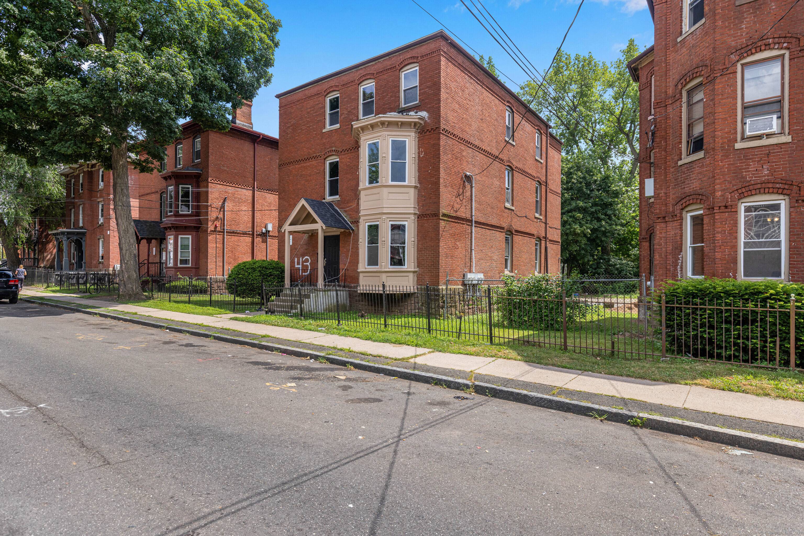 Large three family brick, one of the largest in the city boasting 4 bedrooms per unit and 1, 525 square feet per unit.