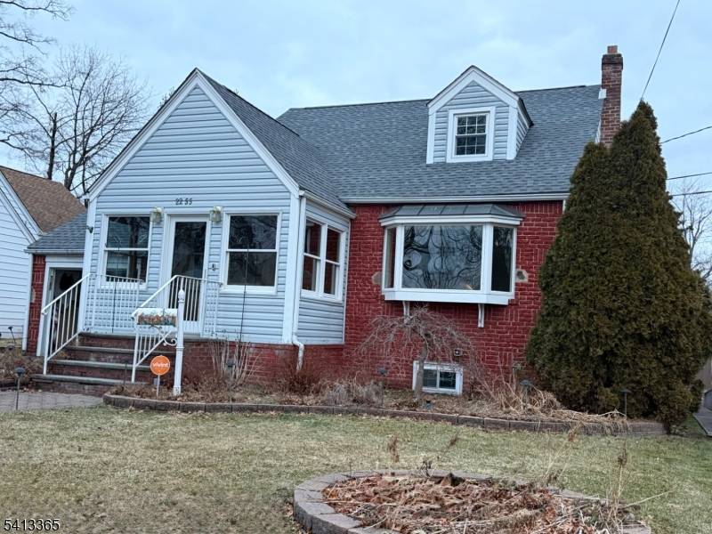 A pretty front enclosed porch with tile floor welcomes you into this 3 BR cape cod with brick front and aluminum sided exterior.