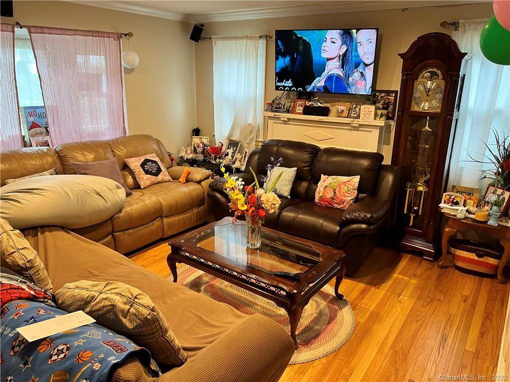 Lovely cape located in downtown Danbury with Central air and City water sewer.