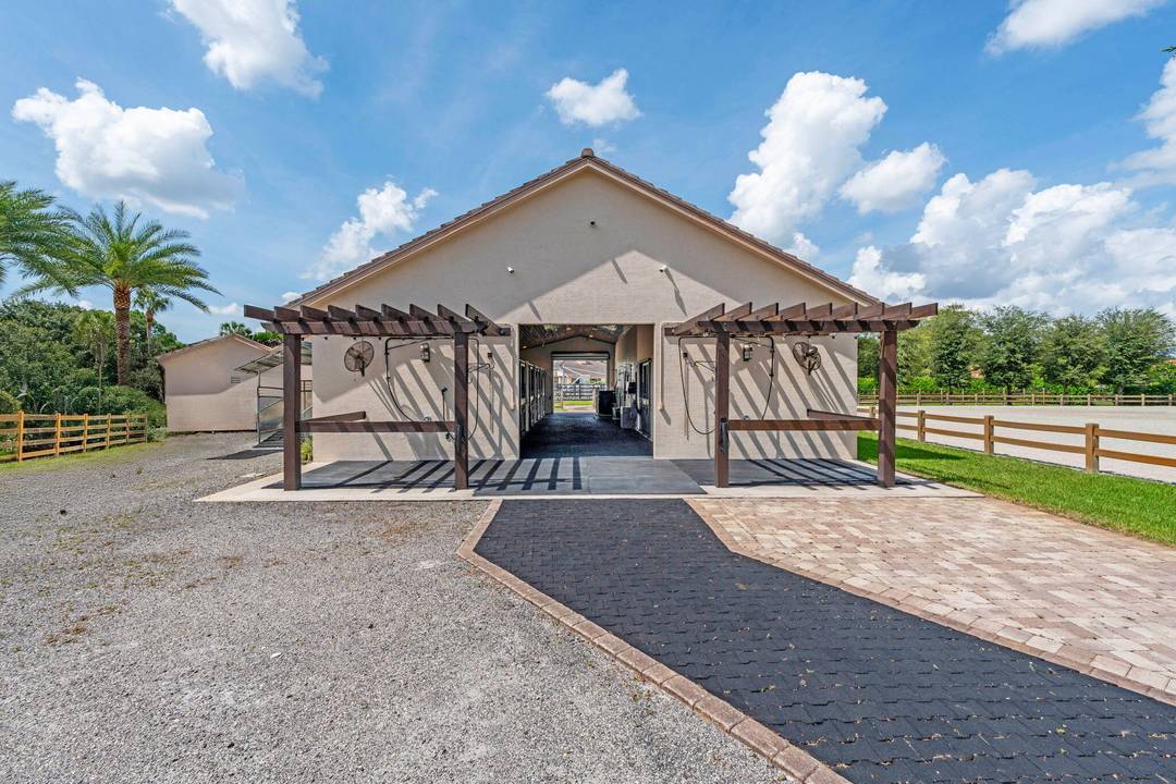 Available for season this exceptional Wellington property spans two adjoining properties totaling 3.