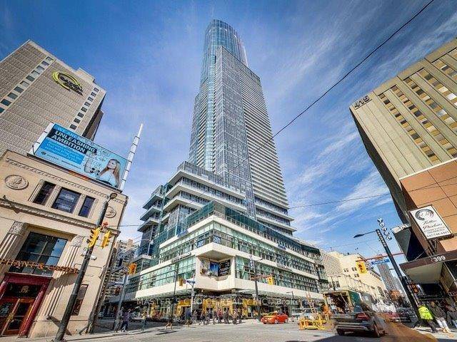 One of the tallest Luxury Landmark Condo At College, Open Concept, Modern Kitchen With Central Island.