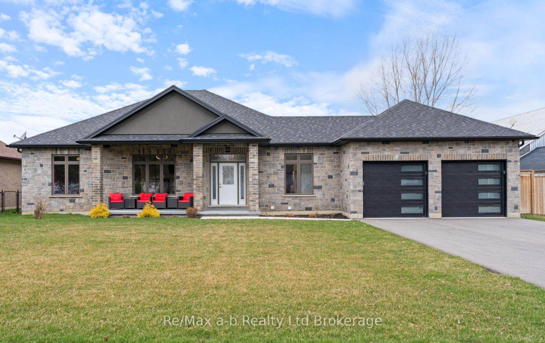 Prepare to be captivated by this exceptional, like new bungalow with 2 car garage and backyard oasis in the quiet Village of Windham Centre.