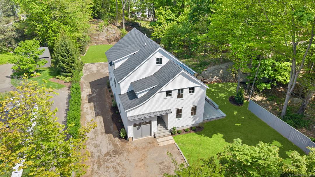 Stunning 3800 SF of new construction, tucked well away from the road offering a private setting on a.