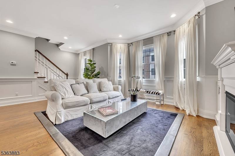 This stunning townhouse epitomizes luxury and privacy, offering 3 bedrooms, 2 full baths, 2 half baths, plus an extra large den.