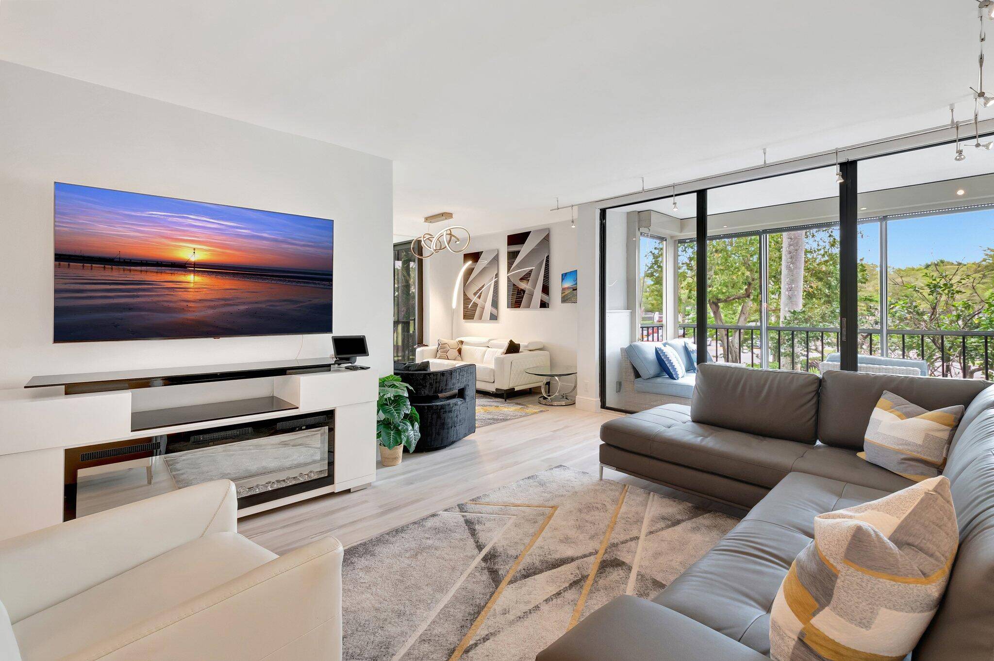 Beautifully renovated corner unit is move in ready and perfectly designed for resort style living.