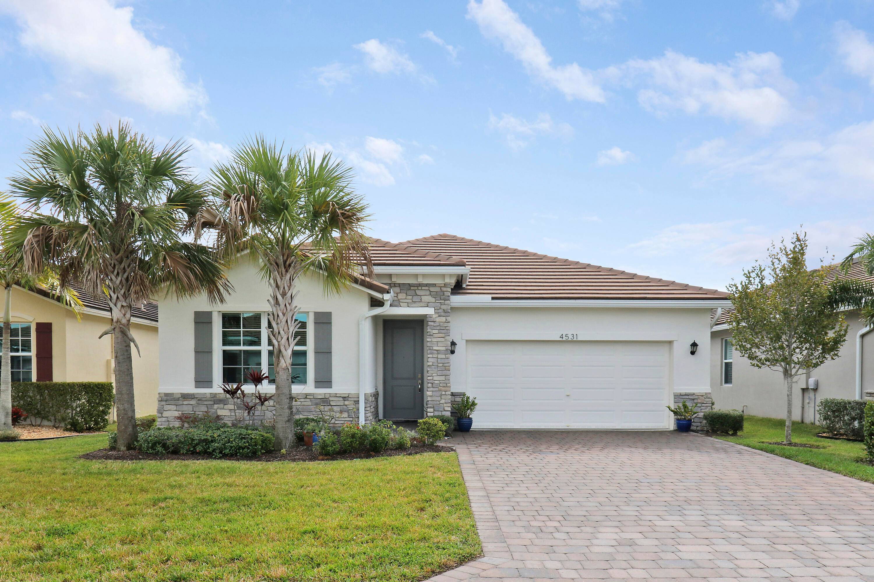 Welcome to your dream home in desirable Jensen Village at Jensen Beach County Club !