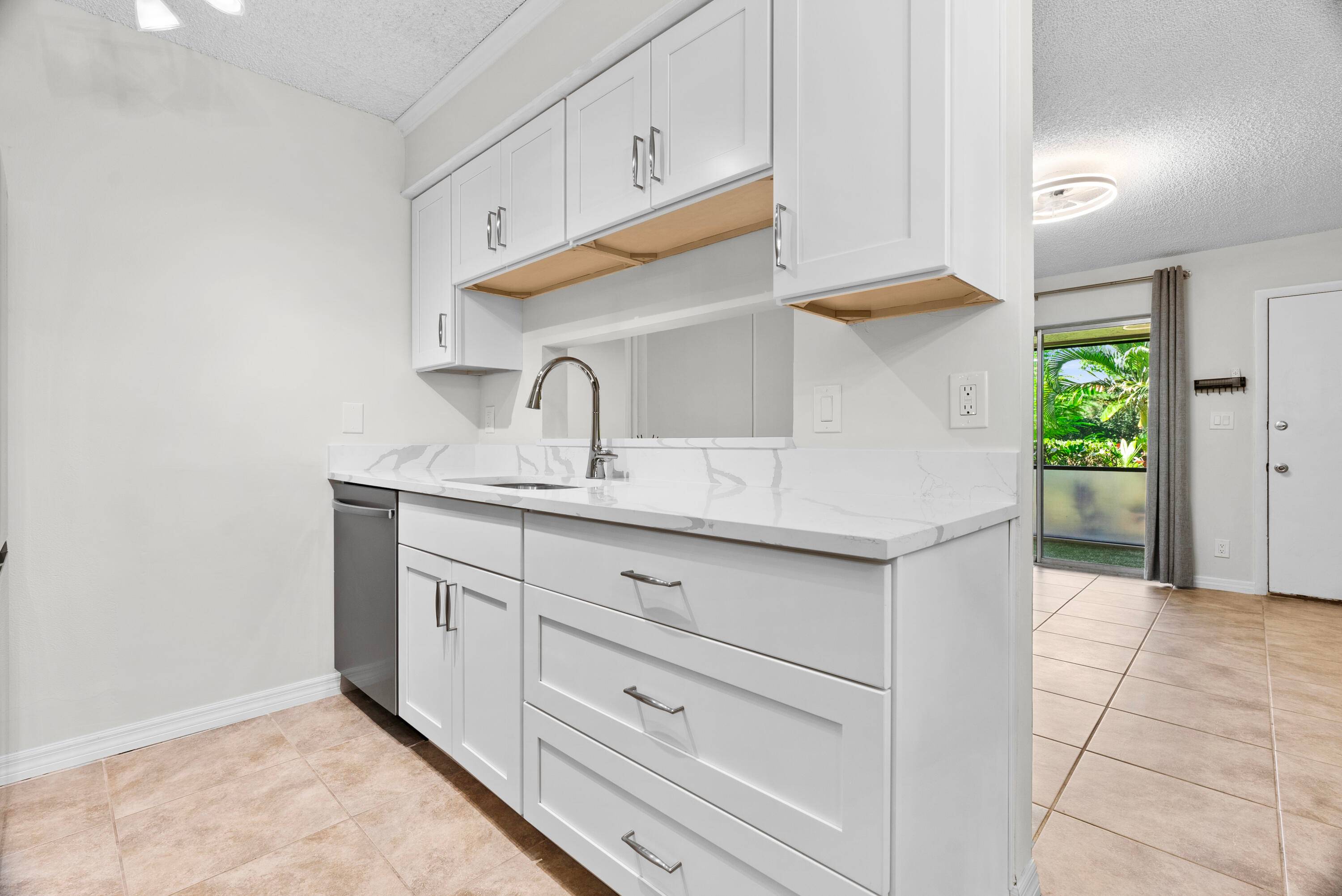BEST DEAL in Jupiter ! Beautifully Renovated 2 Bed, 2 Bath Condo with Premium Upgrades Designer Touches.