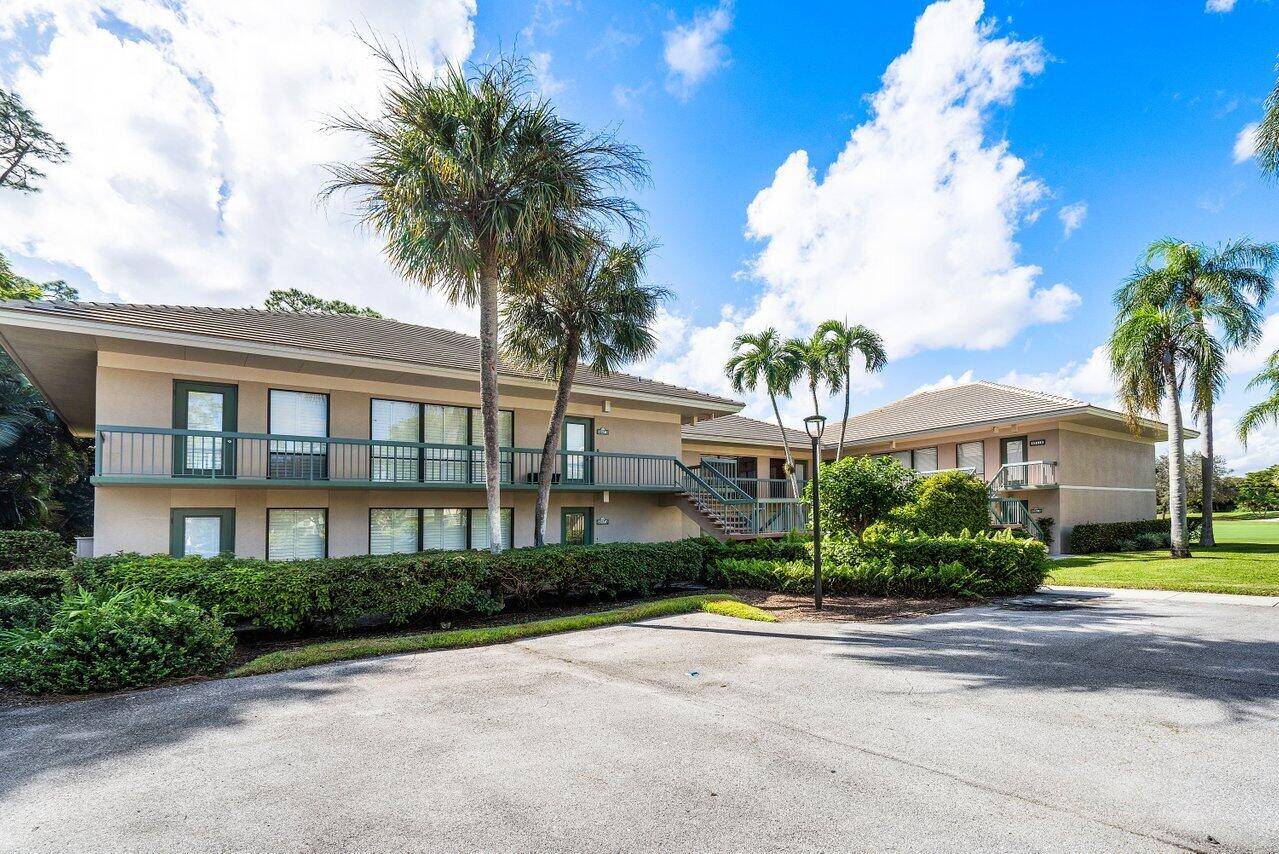 Nestled in a secluded tropical enclave of the Sandpiper section, this charming first floor condo offers both privacy and convenience.