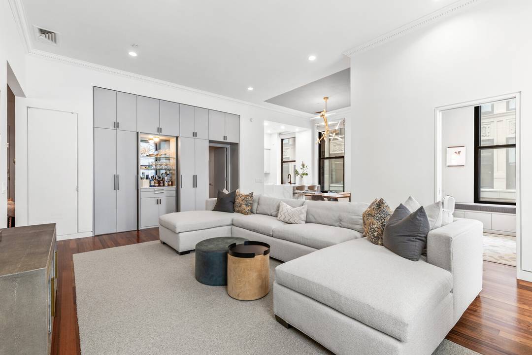 No detail was overlooked in this renovated 3 bedroom, 2 bathroom corner prewar loft in this boutique TriBeCa condominium.