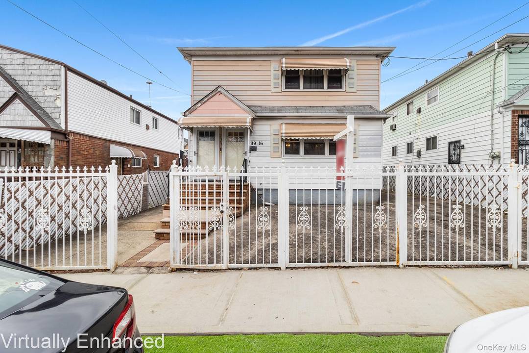 Welcome to 119 16 204th St, a well maintained multi family property featuring a classic exterior fac ade and clean curb appeal in the heart of St.