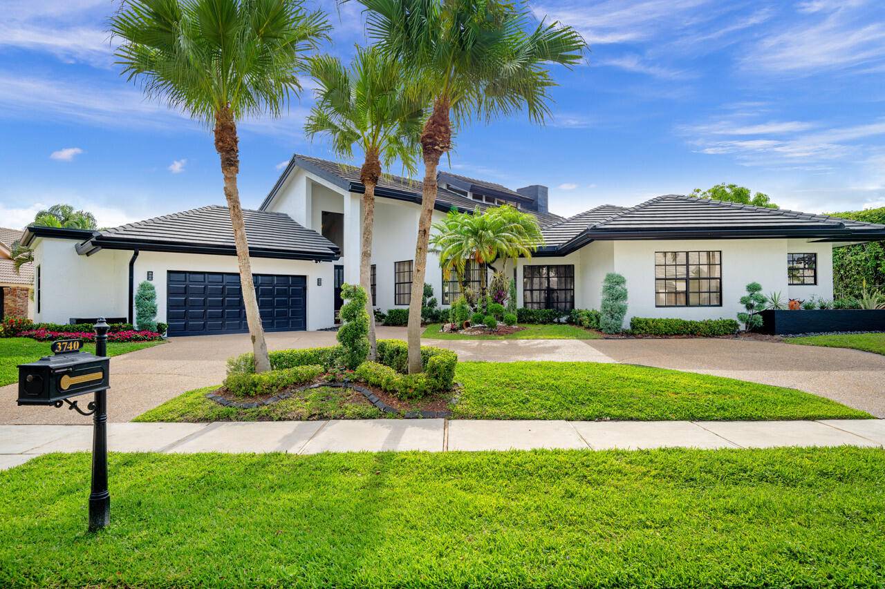 Welcome to this exceptional one story estate in the highly sought after Woodfield Hunt Club in Boca Raton.
