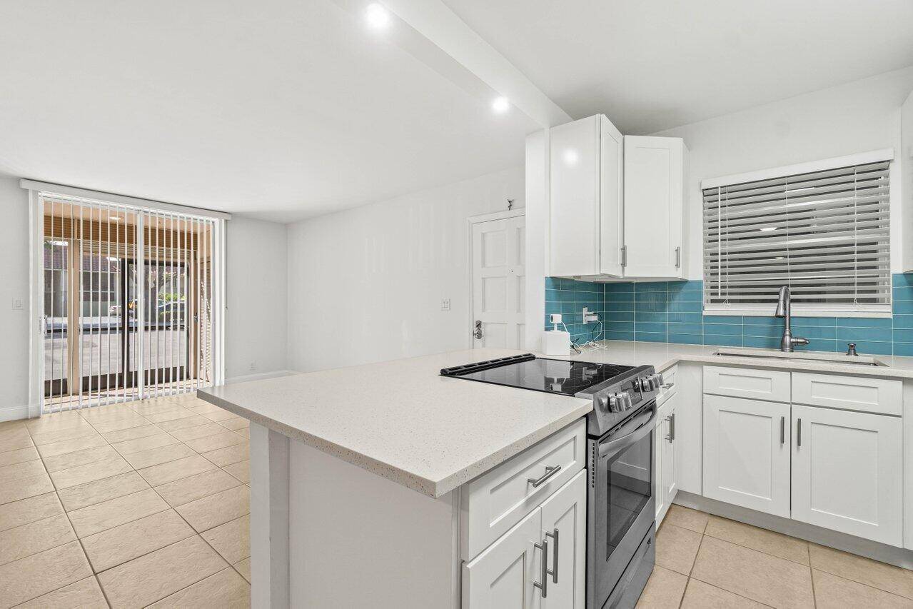 This stunning 2 bedroom, 2 bath corner unit showcases modern living at its finest.