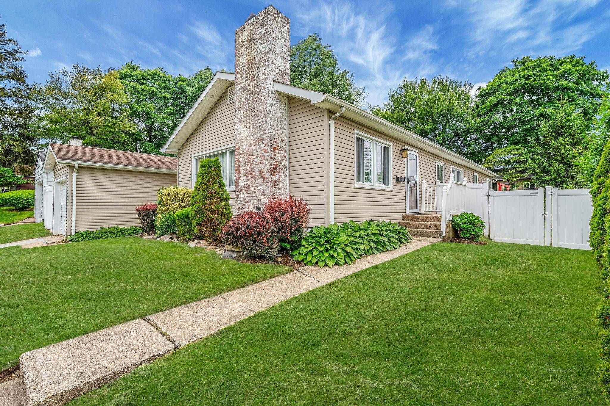 Set on a quiet block, this expanded ranch offers a surprising amount of space inside and out.