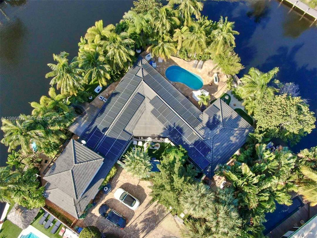 Welcome to The Sanctuary, a rare point lot waterfront estate in Wilton Manors offering approximately 210 feet of ocean access canal frontage with a 35 ft dock on a peaceful ...
