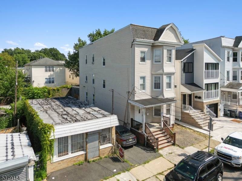 3 family investment property features a total of 6 bedrooms and 3 full baths, with each unit offering 2 bedrooms, 1 bath, and separate living and dining rooms.