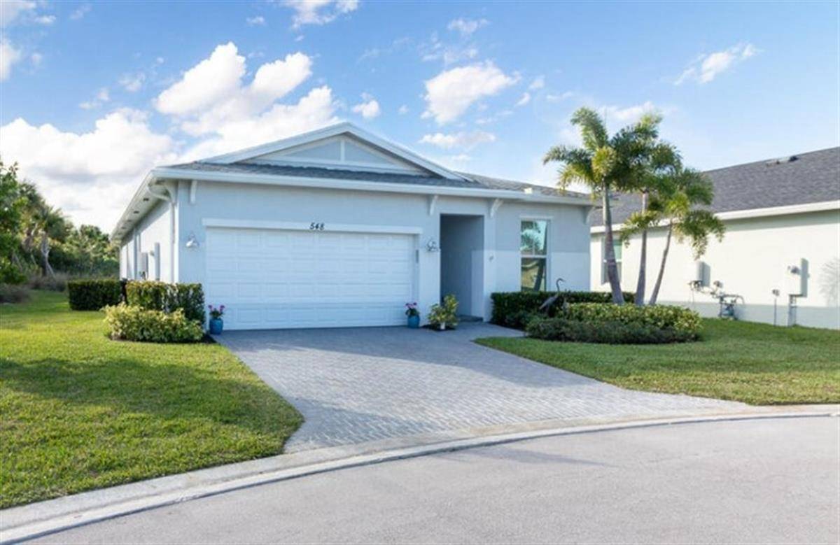 Welcome to 548 SE Plumeria Drive where comfort, charm, and community come together !