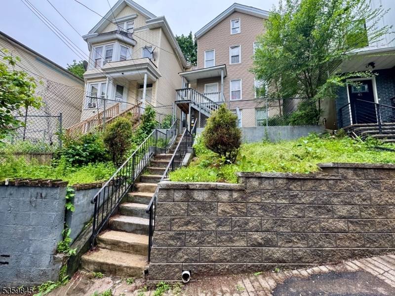 Recently Renovated Two Family Home Residentially Located Features Central Heat, Hardwood Floors much more