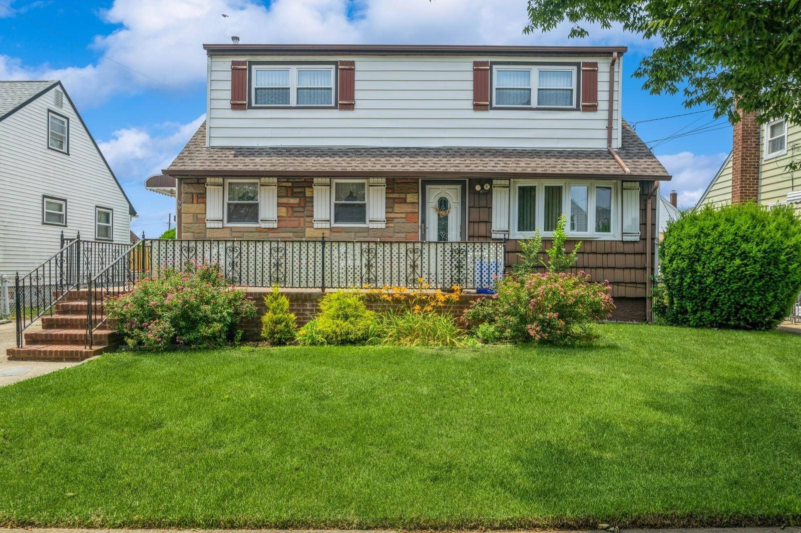 Cozy 2 Family Set Mid Block in Quiet Residential Neighborhood in the Village of Valley Stream.