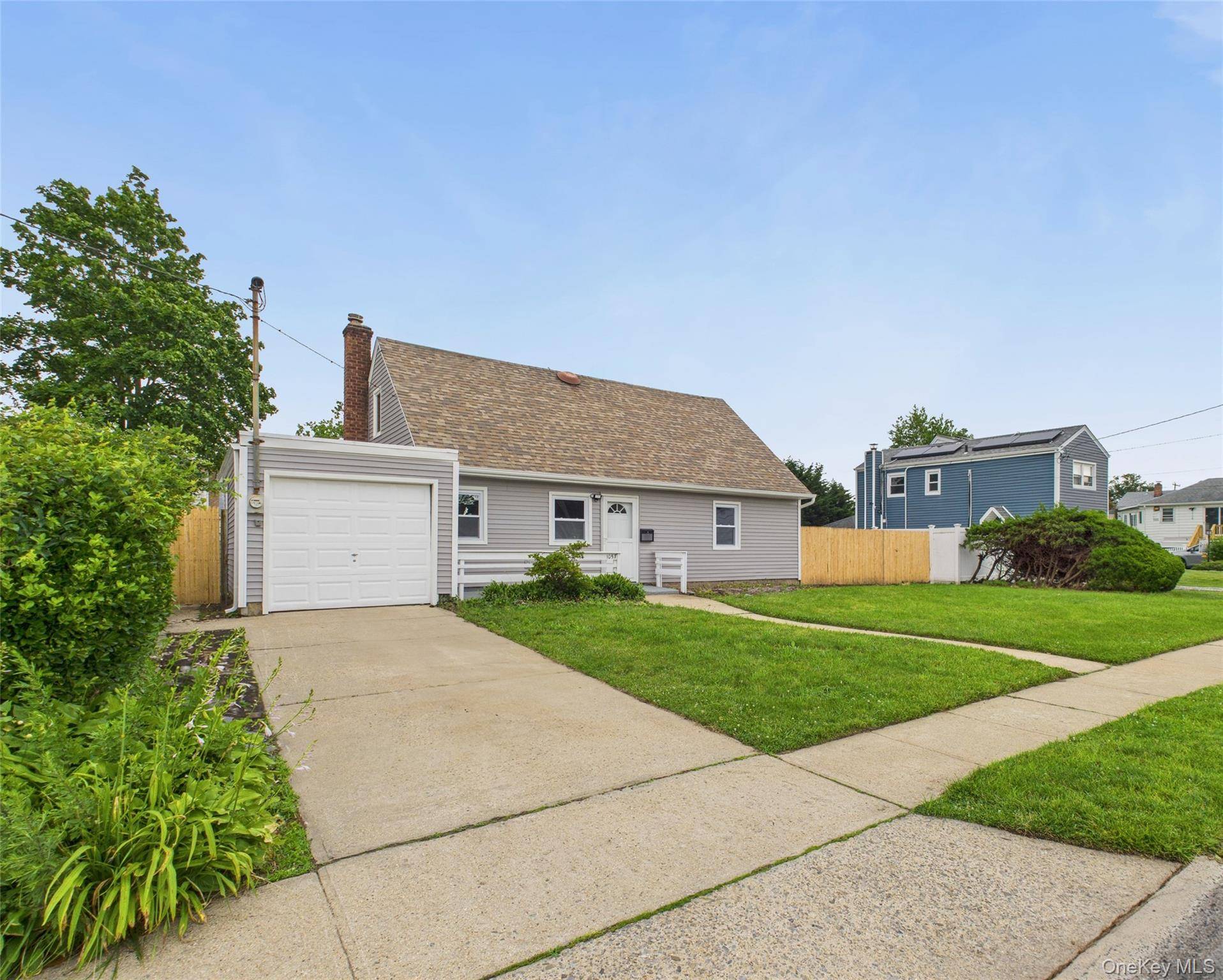 Beautifully renovated 5 bedroom, 2 bath Cape in the heart of Baldwin.