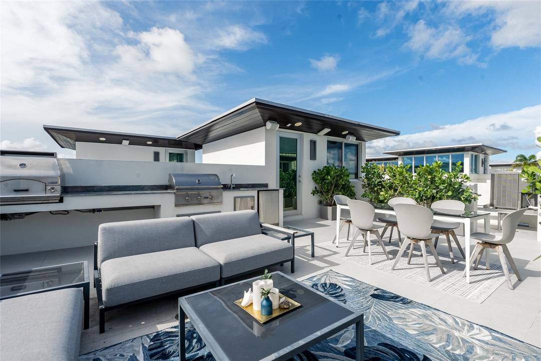 Completed in 2022, this 4 level townhome in Lauderdale by the Sea blends modern luxury with laid back beach living.