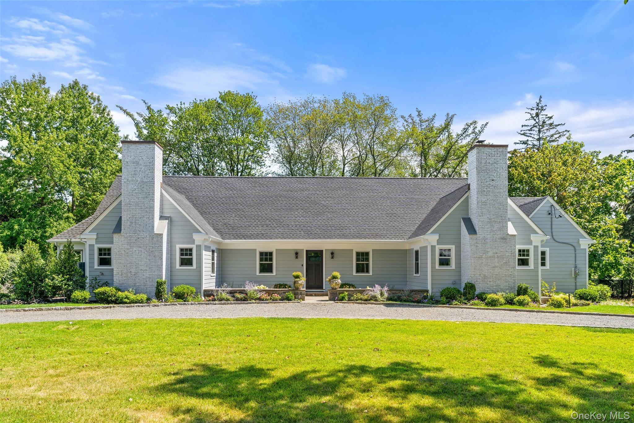 Move right into this stunning, fully rebuilt home in Scarsdale s highly desired Quaker Ridge neighborhood, featuring 4 beds, 3.
