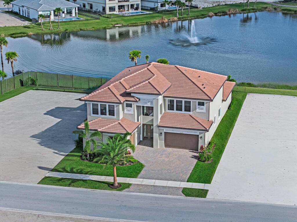 Lakefront luxury in this 5 bed single family home in Avenir, new construction by GL Homes with over 5, 100 sqft of refined living space.
