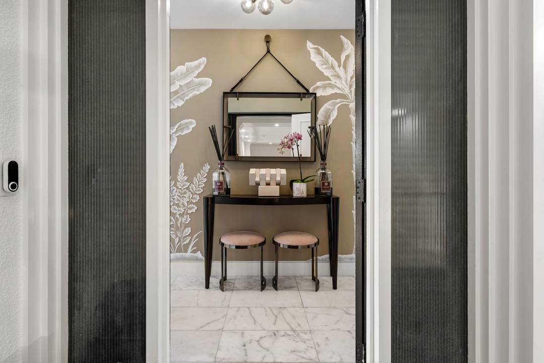 Experience the ultimate in elegance and tranquility with this newly renovated corner residence, perfectly positioned on an exclusive and secure island in Palm Beach.