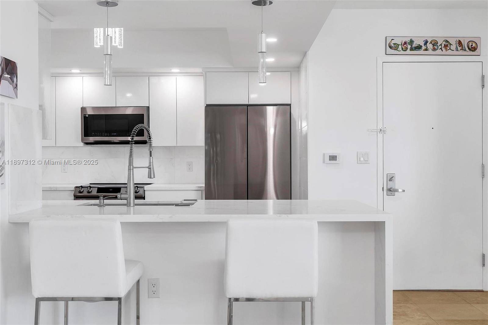 Look no Further. This stunning move in ready, fully renovated from floor to ceiling 2 bed 2 bath plus den unit features New modern kitchen with waterfall quartz island and ...