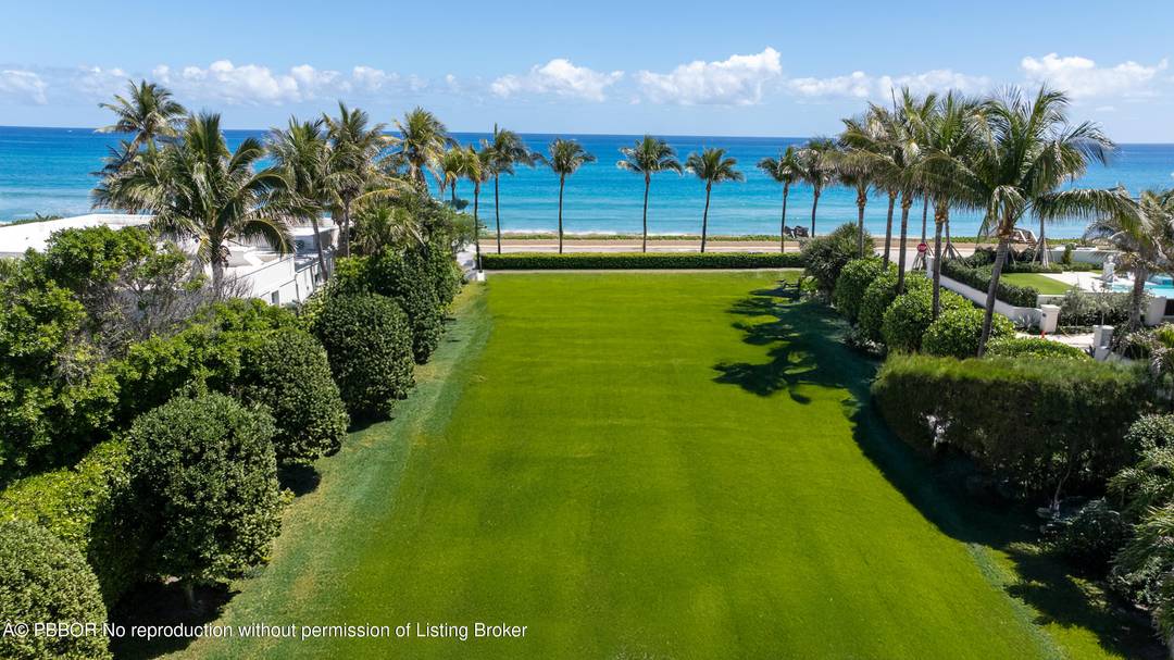Situated in Palm Beach's prestigious Estate Section, this exceptional oceanfront parcel presents a rare opportunity to build on a unique corner lot with beachfront access on Billionaire's Row.