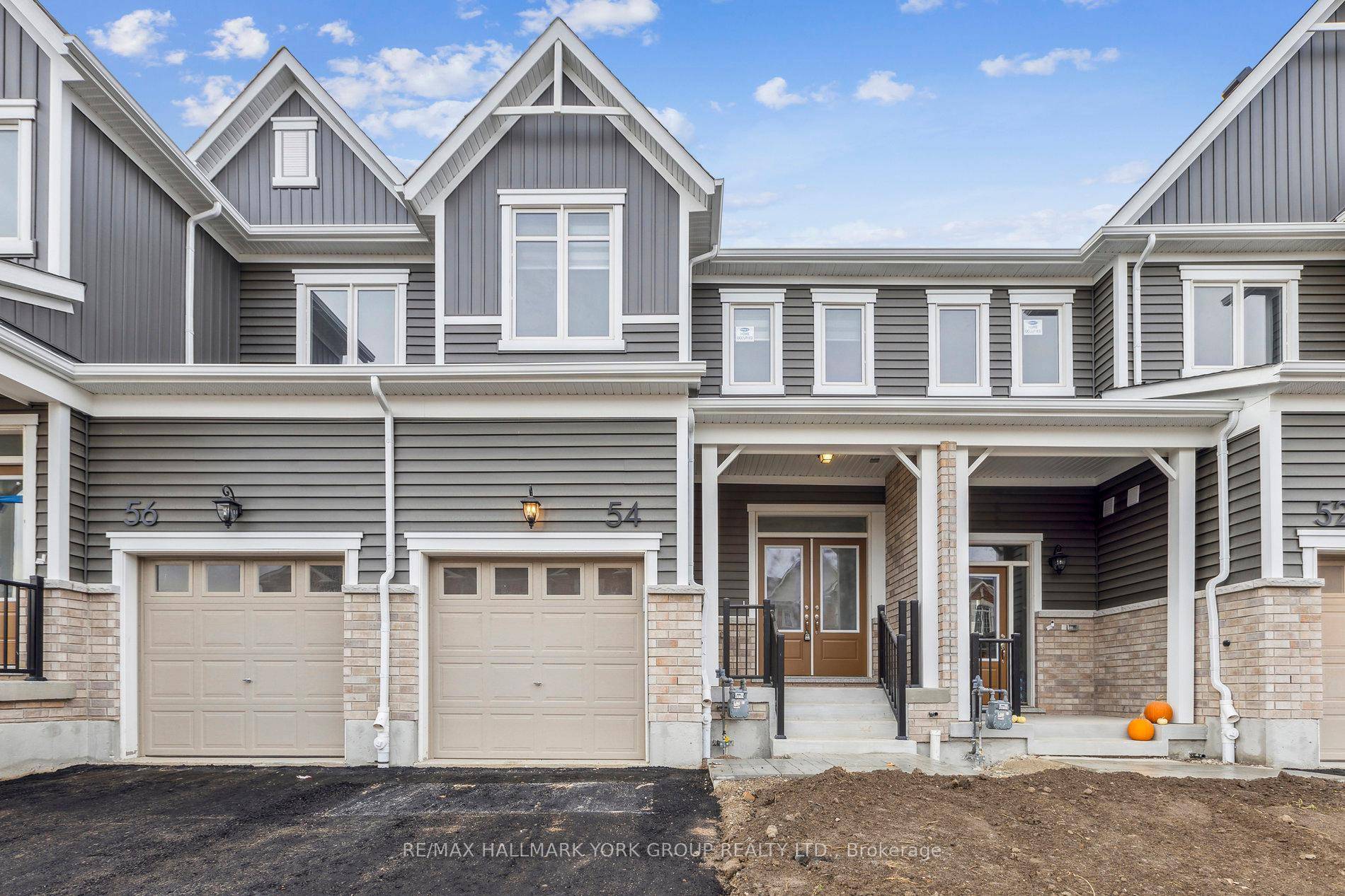 2 storey 4 bedroom freehold townhome, upstairs laundry room, upgraded master ensuite with double sink and glass shower, designated door constructed from garage entrance to basement