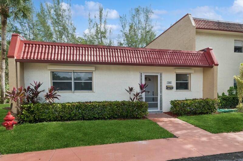 Step into this beautifully renovated 2 bed, 2 bath corner villa in the vibrant 55 community of Golden Lakes with gorgeous canal views !