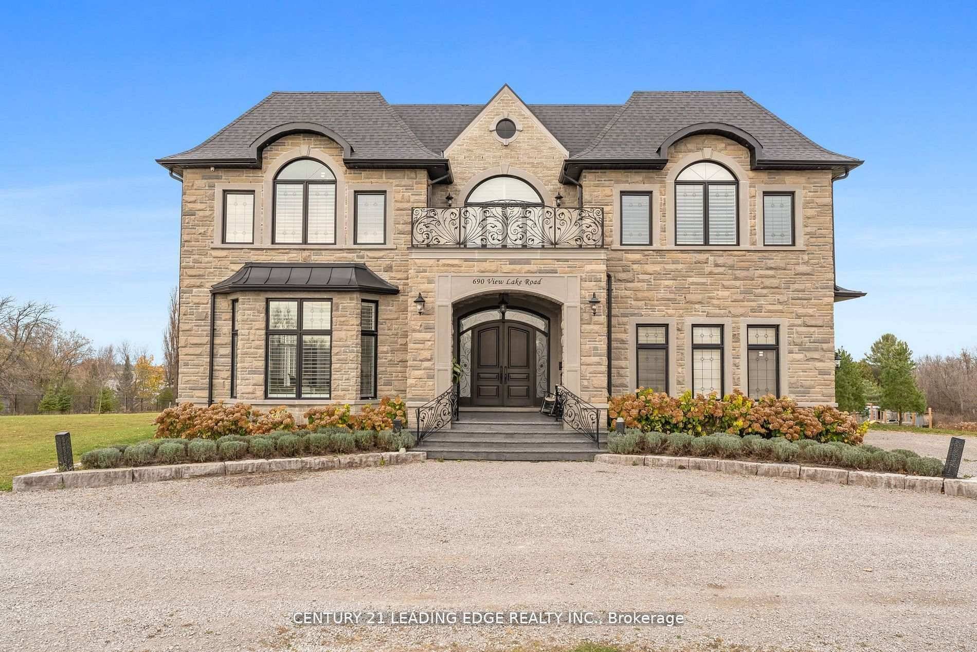 Stunning and elegant estate home nestled in desirable lakeside community.