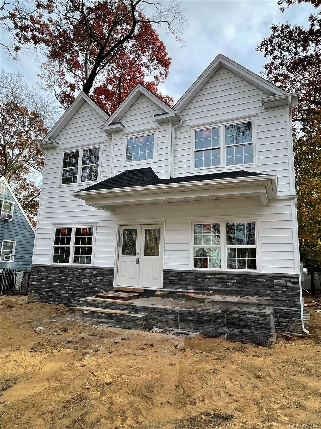 New Construction ! Center Hall Colonial with a Covered Front Porch Stacked Stone Detail and Slate flooring.