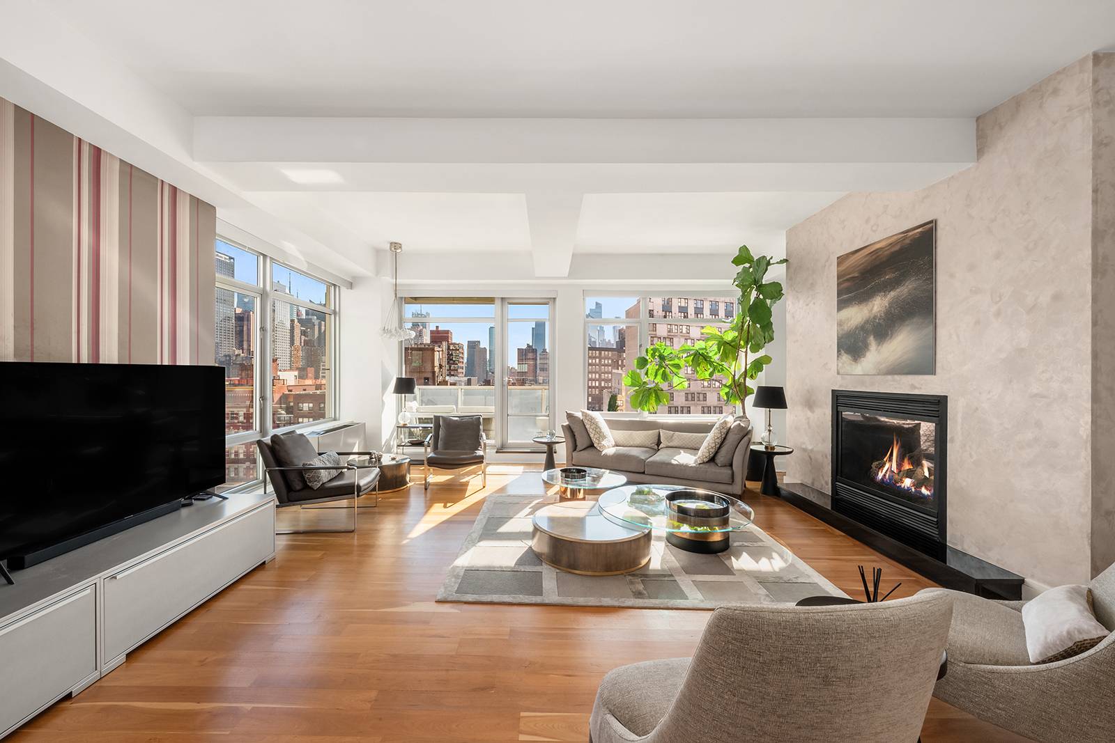 Light filled and open, this elegant three bedroom, two and a half bathroom Penthouse sits perched atop the prestigious boutique condominium building at 426 West 58th Street.