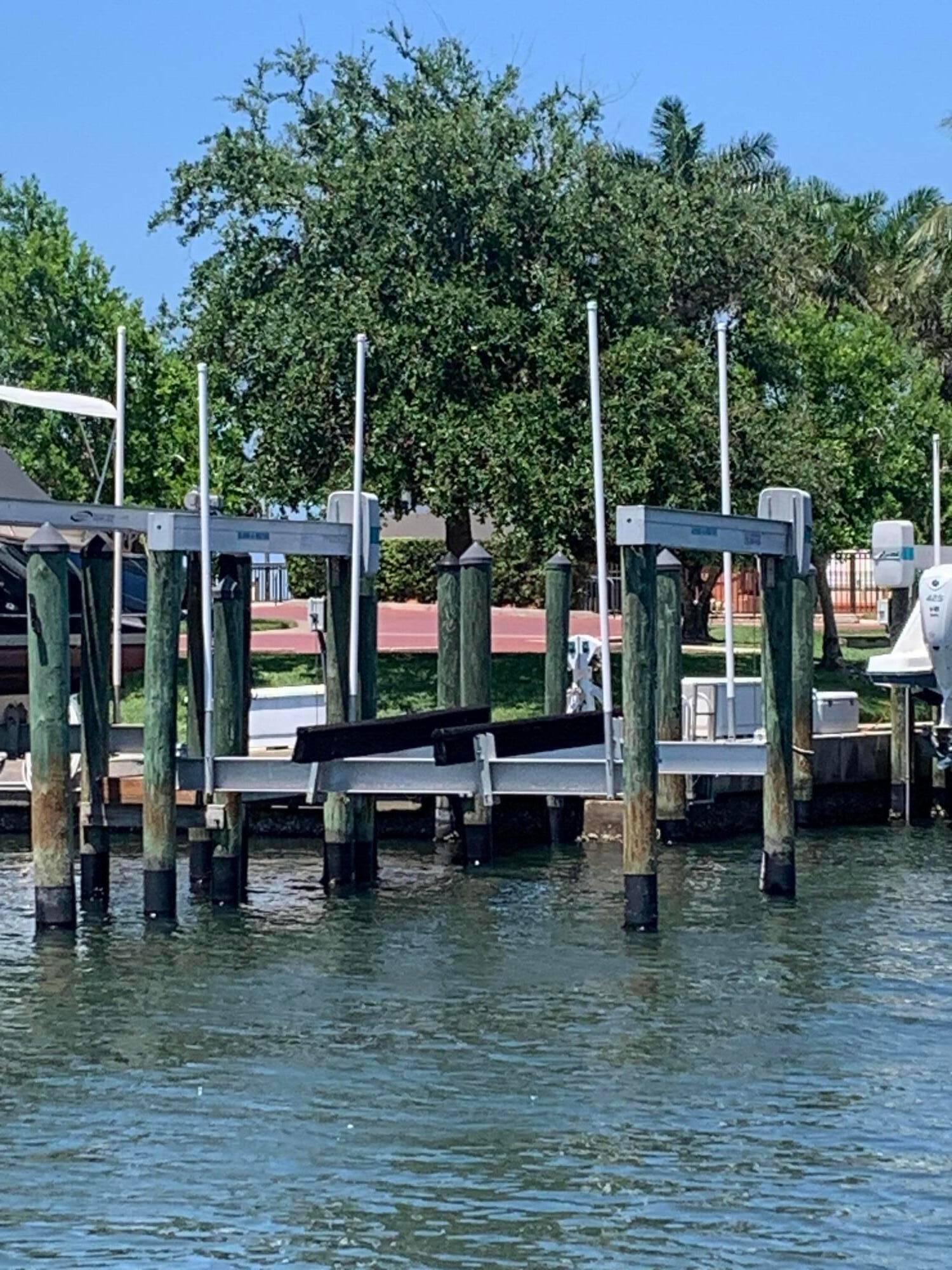 FABULOUS OPPORTUNITY to OWN A DOCK SLIP with a LIFT in this PROTECTED MARINA OFF the INTERCOASTAL in JENSEN BEACH !