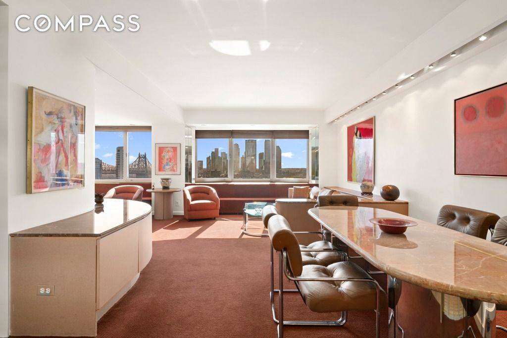 A beautiful and spacious corner 2 Bed, 2 Bath with spectacular river views and glorious light in one of the most prestigious buildings on Sutton Place.