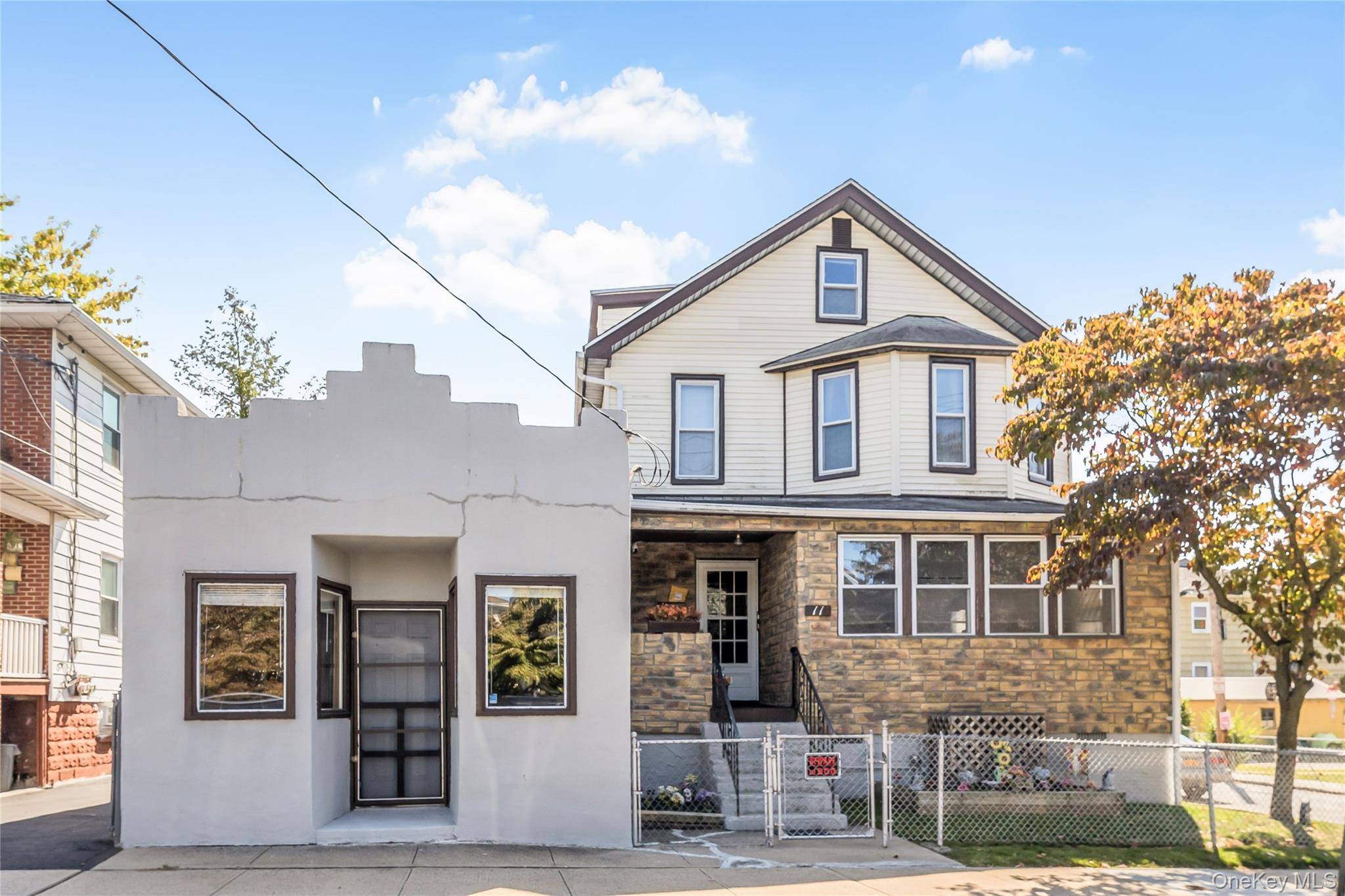 Versatile 2 family home with an attached store offers flexible spaces and lifestyle opportunities.