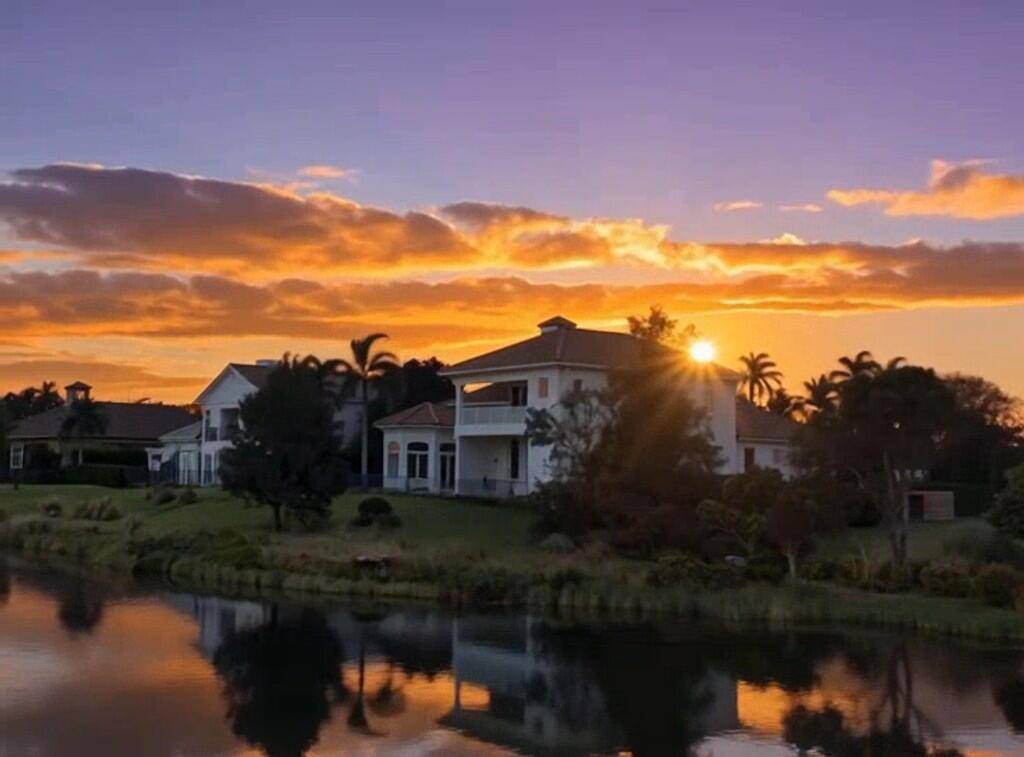 Southeastern views of a freshwater creek the Arnold Palmer Golf Course are yours from this home's private backyard.