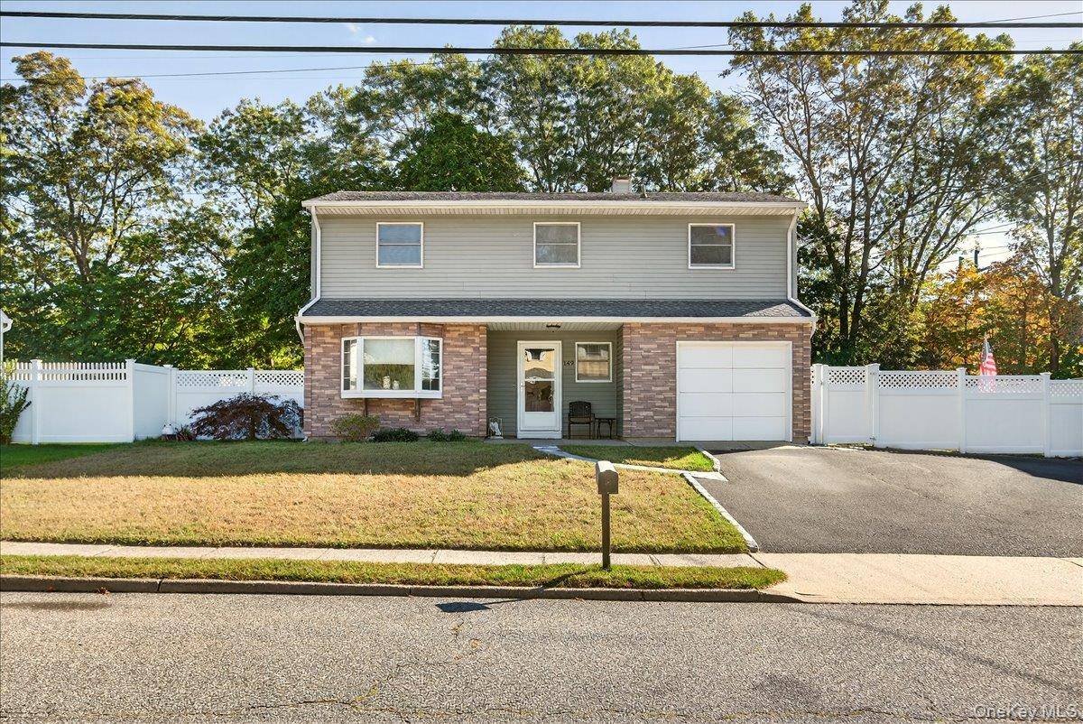 Welcome to 149 Avenue C, a beautifully maintained split level Colonial located in the heart of Holbrook within the desirable Sachem School District.