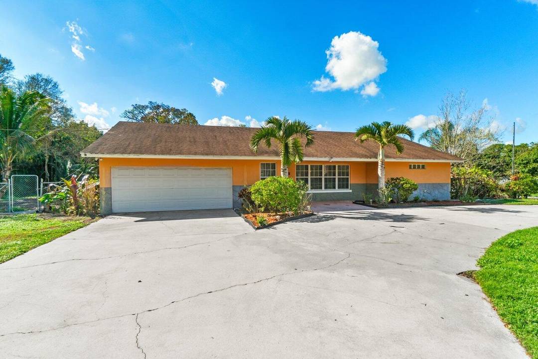 Spacious 4 bedroom, 2. 5 bathroom pool home with a 2 car garage, set on over 3.
