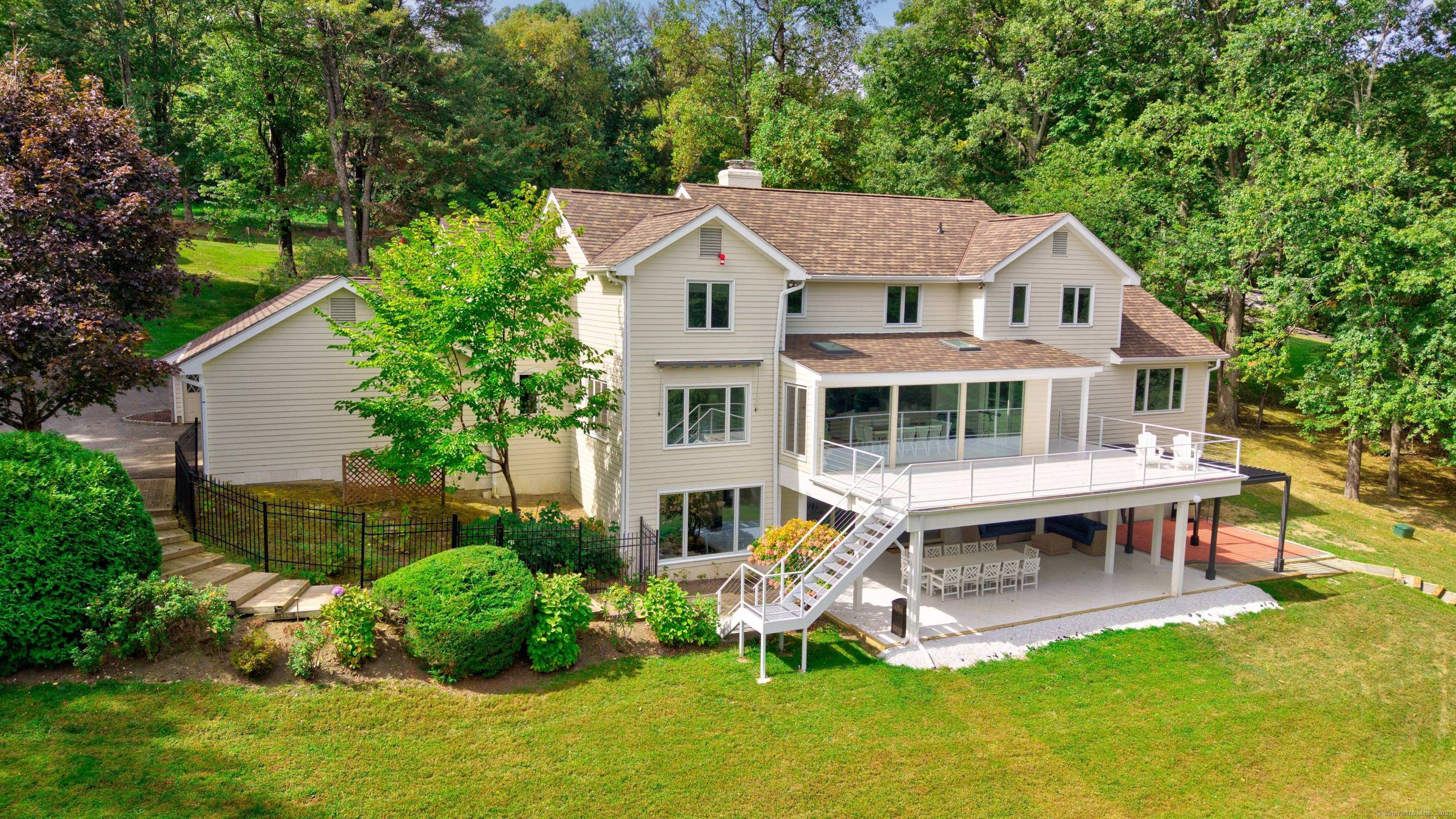 Grand FULLY FURNISHED 6, 700 SF Mediterranean, direct waterfront on two seriously private acres in Sail Harbor Club.