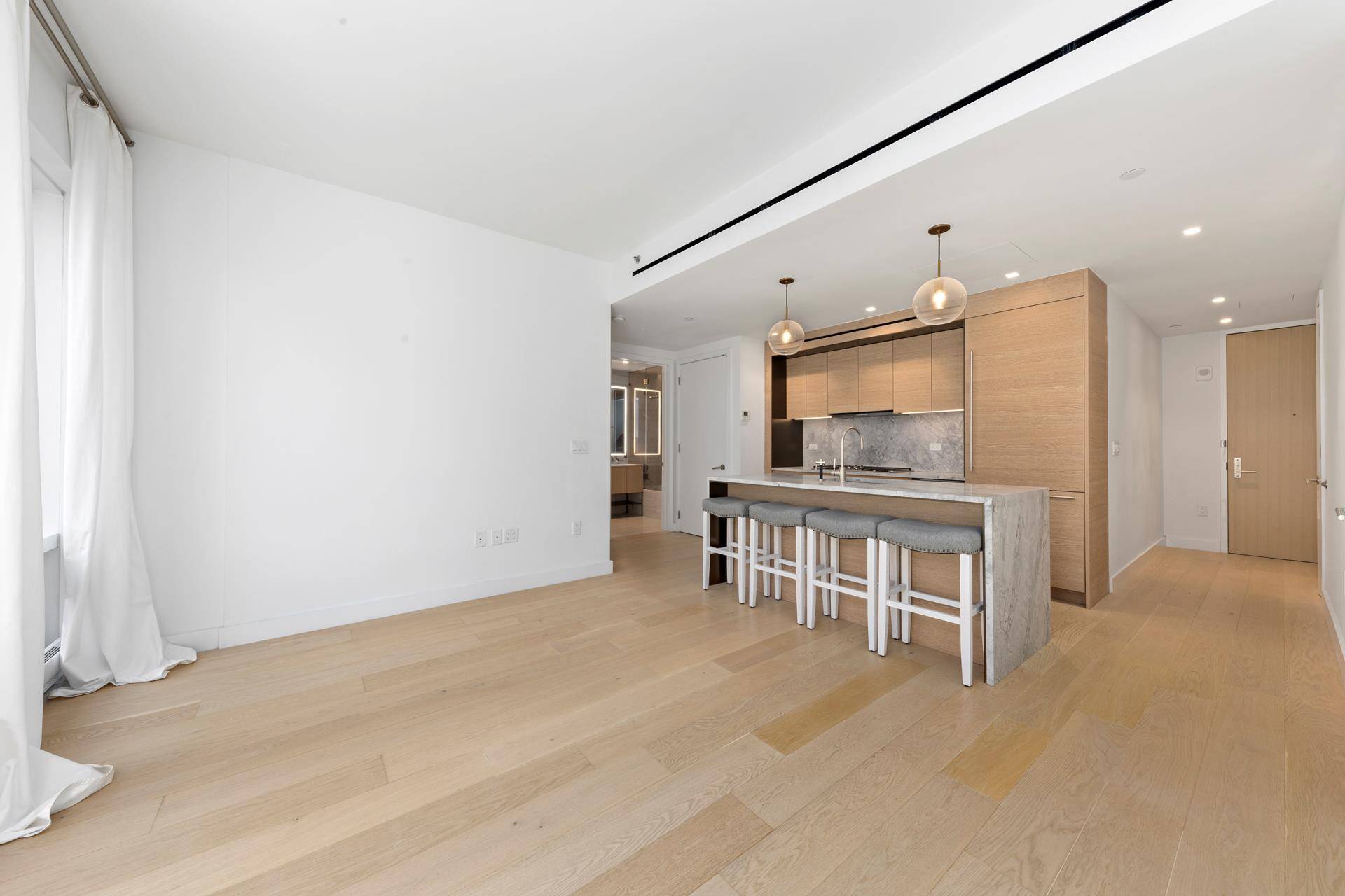 This well designed one bedroom, one bathroom residence features Southern views and seven inch wide white European oak flooring throughout.