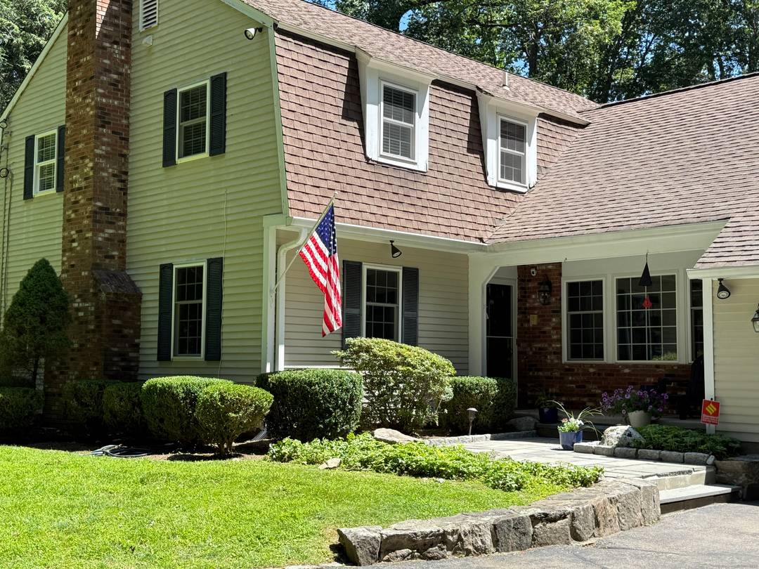 Move right into this beautiful, classic colonial home, nestled on over an acre of land on a quiet North Stamford cul de sac.